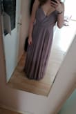 I don't want to take it off anymore! The fabric feels wonderful and the quality is soo good. It's kinda heavy so it doesn't float up or anything and you can't see through the many layers. I normally wear a European size M (36/38) and this one is L so I think the dress runs a little small. But it's also very long so you can wear heels and it still touches the floor (I'm wearing 8cm heels in the photo). Will wear it as a maid of honor dress and I love it. - Lisa S.