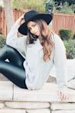 I have a small head so I was afraid this hat  wouldn't fit...but it fit perfectly !! You can dress it up or down. The best part is you don't need long flowy hair to make it cute you can wear it with your hair up and some side flowy pieces . If you are thinking about getting this hat....think no more. BUY IT NOW!! - Jaidean E.
