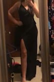 The dress is very pretty. When I received it, I realized that the lace in the back was stitched completely opposite of the other side. - Alyssa L.