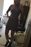 This sweater dress is super cute, especially around the holidays because of the color, but it's definitely on the tighter side. I ordered the XS, and it fits well overall, but I have to be careful when I wear it because it shows off every curve/stomach bloat. Size up if you want a looser fit. It's also a tad short. I usually wear it with tights though, so that's not a problem. Other than sizing, the material is so comfortable. There's an extra layer of material underneath that adds a lot of extra warmth. Overall a super cute dress! - Laurel N.