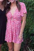 This romper is so adorable. The material is so soft and bright, and the tie in the front is super cute, making this romper really adjustable. It's pretty short and flowy, so just be aware of that. I wore it to my sorority function, but this romper would be perfect for so many occasions and can be dressed up or dressed down. I wore a sticky bra with this, but also would look great with a bandeau. - Anna D.