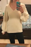 I absolutely love this sweater! It might be the coziest thing in my closet right now. It is definitely oversized so unless you want it really baggy, I would size down. I'm usually between a small and a medium and went with a small and I'm really happy I did. I'm tall so finding sweaters that are long enough in both the torso and arms can be a challenge and this fits perfectly. Definitely considering ordering it in other colors. - Laura M.