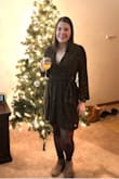 I absolutely love this dress! I usually wear a medium in dresses because I worry about them being too short, however, I was glad I ordered the small in this and it fit perfectly. I was worried about the bust but it turns out the tie on the front of the dress can be tightened and adjusts the neckline when you do so.
When in a well-lit area, the dress is much more gold looking than in dim-lighting, but still equally pretty! I also appreciate that the material is comfortable and non-scratchy like other sparkly dresses I've worn have been. Definitely recommend this dress! - Larissa W.