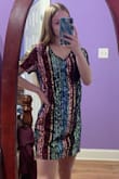 I bought this dress for one of my senior picture outfits because of New Year's and I think it's going to look great! This dress itself, being an XS, is still a little big around the stomach area but it is perfect in length. Although, the material is definitely not stretchy and when I raise my hands up the dress goes up a lot. Overall, very happy with this purchase and for the most part it is true to size. - Alyssa P.