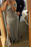 It was slightly looser than I'd normally wear my gowns. The looser fit made the very large thigh-split less vulgar, so I was really happy about that. The bust was also loose for my 34b/c cups, but with some fashion tape and a good bra I was able to make it work. - Katherine C.