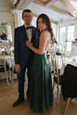 The dress is absolutely stunning. I had to go to the seamstress to make it shorter because I was to small for it, but I was expecting it so it doesn't bother me. The material is pleasant for the touch. Everything fits. Overall, I highly recommend this dress. I will wear it to many more parties. - Margaret K.