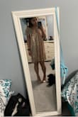 I ordered a size extra small, and the first picture shows how large it is on me. I was disappointed at how baggy it looked on me, but nothing a couple alterations couldn't fix! I had someone bring it up in the shoulders, take in a little bit of fabric on the side, and shorten it a couple inches... it fits me perfectly and proportionally now (second picture)!! Most people aren't as small as I am so they most likely will not have this problem, just order a size down! :) - Hayley V.