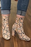 I am 5' 5," 120lbs, and my legs are very proportional to my body. My calf muscles are very average in size, so I know I am not an anomaly. The boots are adorable, and I wanted so badly to love them. When I got them out of the box I was so excited, the color, style and material look excellent. Sadly they were way, way, WAY too tight around the top. So tight I could barely get the zipper up, and I mean, look at these images- they're comical. My foot fit in the shoe without any issues and the size was true (I am an 8.5): plenty of toe space, heel height was comfortable, I have average width feet and they felt good. BUT MY GOODNESS it choked my legs so bad I knew after 20 minutes of walking I'd have open sores and no circulation. I couldn't wear a thin tall sock underneath OR tuck in my jeans. I would give 5 stars if I could wear them. I noticed in the comments and in the model images, those who liked them had slender and long legs. Probably a no go if you're average height/ weight. - Brennah K.