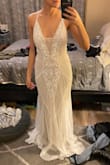 Loved this dress, wish it had a lower back but that's just my preference. Would've been too expensive to alter due to the beading. Will keep looking but this is a contender for my wedding dress. Loved the beading and color and deep V. It fit surprisingly well. - Olivia H.
