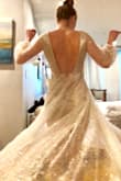 This dress is absolutely full of sparkle. It fit perfectly and looks dazzling when you twirl. Is definitely a show stopper. Beware it does shed sparkle immediately when you take it out of the bag so be careful of that on the first day. After the initial shed it still loses some sparkle with each wear but not as it does upon first opening. Don't worry though the dress still sparkles the only notice of lost sparkle is on the floor. - Briana M.