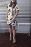 I can't say enough good things about this dress. It's flirty, fun, and the perfect summer dress. I wore this for my bridal shower and it's light enough for hot summer days. Be careful around windy days, because the dress does fly open pretty easily, but that's a quick fix with some fashion tape. Highly recommend! - Allie G.