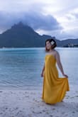 It's so simple but so elegant. I know it was supposed to be a midi-dress, but it worked out for me regardless! I bought this for my honeymoon trip in Bora Bora and there are no regrets. It hits me a little above the ankle in terms of length. The material feels nice and not cheap at all. It does wrinkle easily, but a bit of steaming does the trick. - Lanvi N.
