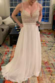 The beading on the bodice is beautiful and the sequins make it much more sparkly in person than it appears in photos. The skirt fabric feels lovely and luxurious and flows gorgeously. The bodice is a bit stiff in the straps and somewhat uncomfortable, and it was a bit too much boob for my wedding venue. The gap between the top of the bodices and chest is quite noticeable and bothered me somewhat. But it would be lovely for a swanky evening event, and I loved how flattering it was. If it had been more appropriate for my event (perhaps thicker straps and slightly more chest coverage), I would have kept it and had it altered to fit perfectly. - Alison M.