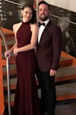 I bought this dress for a wedding around Christmas. It was a perfect formal dress without feeling overdone or over the top. I was a bit short in it so I had to kick forward when I walked to make sure I didn't trip on it. The material has a good weight to it but it didn't feel like it was tugging on my neck. I couldn't wear a bra with it but I used pasties and tape to hold up the girls and it worked fine. I got many compliments throughout the night. I want another excuse to wear it again! - Maura S.
