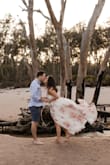 Ladies, if you're looking for a dress for your engagement photo session, please look no further. This dress is absolutely stunning (see photos for proof.) I originally ordered a small but the bust was just slightly too small for my boobs, the tiny snap wouldn't stay buttoned. I opted to get a medium instead of trying to get it tailored and it worked just fine! It was a little big, as in there was a little too much dress, but I wrapped it extra tight and you can't even tell! Shorties, please note it runs LONG. I will need to get this baby hemmed in time to wear it as my wedding after party/brunch the next day dress. - Kayla