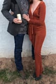 It does run a little big. I usually wear a medium, sometimes a small. After reading reviews I got a small. It was perfect! I got it for a 70's theme wedding - I got SO many compliments! It's soft too! - Kelly F.