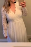 This all fits true to size except the sleeves. Those were just slightly too big. Nothing that I would even worry about altering, and I am wearing this for my own small, intimate wedding in a few months! Everyone loves this dress on me so far! - Katelyn G.