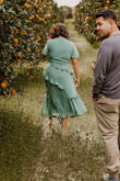 When I wore this, it was tight around the hips and waist but really baggy on top. I thought the style and color was so beautiful so I made due. I stitched the top to make it smaller and wore a girdle for the tightness. Loved this dress! It ended up being the dress I wore when we got engaged! Very flowy and romantic dress. - Gabrielle R.