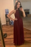 This dress is beautiful and the fabric is really nice quality. I looking for something simple yet effective for my husbands military ball and this was just what I needed. The only problem was the length. It was very long. I had to get several inches taken off and that cost me an extra $70 because there is so much fabric to work with. - Shanna O.