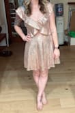 Bought this dress for New Years and it is STUNNING. Didn't realize it was 2 separate pieces until it came in but I loved it! I tend to like A-line style skirts/dresses because my waist is a 0-2 (XS/S) and my hips are a 4-6 (S/M) ... so I figured a Small would be the way to go. It was a little loose all around. I didn't alter the top because it wasn't loose enough to bother me with a sticky bra on... but the waist was definitely too big on me. Had to get it taken in about an inch... but idk that ordering an XS would've been a safe choice for my bust. Overall, love how it ended up looking after alterations! - Jessica