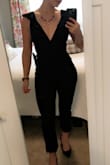 I loved the design of this jumpsuit - very flattering on the neckline/shoulders. The top part fit my small chest perfectly! Unfortunately, the inseam was too short, which is unusual for my 5'4 self. A medium may have fit better on the bottom, but it would've been too big up top. It also didn't conceal my stomach area very well, which isn't much of a problem area, but I'm always self-conscious of it. So, if you are, too, I'd suggest another option or a bigger size that may lay better across that area. - Jennifer Z.
