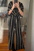 This is the best jumpsuit I own! The material is extremely comfortable, and flowy. Perfect for dancing! The pant-legs touch the floor, which is what I prefer. Could even wear heels with it without being short. And it fits like a GLOVE. The top holds everything in perfectly without being too revealing. I would recommend this to anyone! - Allison M.
