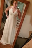 This dress is gorgeous, I was looking for a simple yet elegant dress for my spring wedding. I came across this dress and fell in love. I immediately ordered it and recieved very quickly! As soon as I put it on I knew it was the perfect dress. I felt so beautiful and didnt even want to take it off! It fits perfectly (besides being long since I am so short) but I just need to get it hemmed. I cannot wait to wear this dress on my wedding day. - Katrina S.