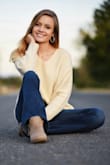 This is a good basic sweater. Definitely more yellow cream colored - Kaley C.