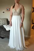 I purchased this dress to try on for my intimate beach wedding ceremony. I love the beading on the top and the flowy skirt. It's definitely a contender, but I'm not 100% certain it's 'THE' dress yet! - Katelyn E.