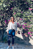 I usually wear a small or medium, but I ordered a large because it was on sale and out of stock in other sizes. Very light and comfortable material. Just as pictured. I usually wear it tucked in since it's a little big. I love it! - Rachel S.