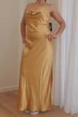 Beautiful fabric. Nice weight, true gold color, shiny and gorgeous. Maybe runs a little large, but it might also just depend how you want it to fit. I may re-order a small if they restock or have this one tailored a bit. - Karen H.