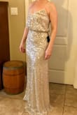This dress is very pretty. I tried both the S and XS and decided I liked the fit of the XS better. It's very long, so I plan on getting it hemmed. I'm wearing 4" heels in the pics. It does hug and cling to the body, so I'll be wearing spanx with it to smooth out the look. - K G.