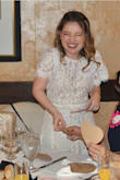 I wore this dress for my bridal shower and it was absolutely perfect. I had been looking for 4 months for a white dress and it's hard to find a white dress during fall/winter! This dress was so beautiful and it fit me so well. It was not tight at all it was extremely comfortable but not baggy. It was so flattering and I got so many compliments! - Leanna R.