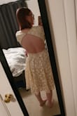 I really wanted to like this dress. The pictures looked great, but once I put it on it was so awful. The back is cut so far out that your sides spill out of it, and it looks terrible and boxy from the front. I had bought this dress in hopes of wearing it for engagement pictures and a rehearsal dinner for my wedding, but I had to send it back. It fits mostly true to size, but the top is so grossly oversized in the top that everything just looked bad. I was disappointed because the skirt was full and perfect but everything above the waist was a disaster. I would not recommend this dress unless you have the money to tailor it. If the back did not gap ALL THE WAY AROUND and instead went straight down like most of the backless dresses, it would have been the most beautiful dress in my closet (besides my wedding dress). I returned it ASAP because it was expensive and I cannot waste money on things that do not fit and look nothing like the images on the site. - Lauren R.