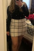 Boy is this skirt cute! I got so many compliments. Fits true to size. I'm 5'3" and about 165 pounds and bought the Large. Material feels like wool, and quality is thick. You won't regret it! - Olivia L.