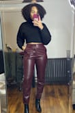 While it is pretty cropped, it looks great with high waisted pants. I need this in a variety of colors. - Amber J.