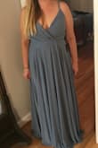 The dress fit really well! The material is really nice and doesn't feel cheap at all. The color is really close to that online even though my picture doesn't show it. SO happy! - Eugenia H.