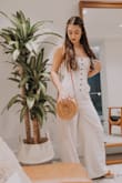 Ugh where do I even begin?! Beyond obsessed with this gorgeous neutral jumpsuit that is perfect for almost any occasion. It fits like a glove & the criss cross string detail on the back is to die for. It's such a classic & effortless look. If you don't own it, you need to! - Laura B.