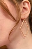 I don't tolerate heavy earrings and these are light, fine for me. Definitely rose gold with a matte finish. I like the unique shape. - Christina M.