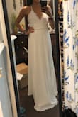 I purchased this in an XS as a potential wedding dress. It fit true to size, but I didn't love it so I returned it - Angell