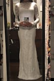 I purchased this in an XS as a potential wedding dress. Very comfortable and runs true to size, but it wasn't the one so I returned it. I did love the long sleeves, but didn't love the high neck. - Angell