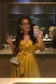 Felt like a golden ray of sunshine! Perfect dress for dancing. My only complaint is that I had to remove the little button that kept the bust closed. It kept popping open on me.
But it didn't take away from the dress at all! - Monique O.