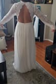 The back is drop dead gorgeous. Runs really large so I would order 1-2 sizes down. Sleeves aren't fitted to arms, they're more roomy. - Stephany S.