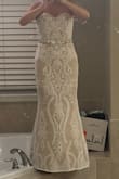 I wore this dress for my elopement ceremony. In the end I think it looked pretty good. I originally ordered it from Nordstrom, but the lace pattern so far off center it was odd looking. When I brought up my concern to Lulus directly when ordering another one, a Lulus representative said they would double check the pattern before sending it out. I only had a week til the ceremony so I was nervous! It worked out well as a stand in since I couldn't find a real wedding dress in time. I did have to take off 4" from the bottom as I am 5'2" and wore 3" heels. I played with the idea of wearing a trumpet crinoline. I liked the look, but decided against it. I will post photos both ways. It looks a bit more bridal with the petticoat. - Holly D.