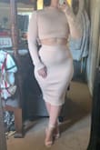 I love this material, it's very thick so it would keep you warm if worn in the winter! The overall look of it is soooo cute but I'm definitely going to have to exchange it for a medium. The sleeves/top are way too big on me, I have the top rolled up twice so it even looks like a crop and the skirt twists around on me when I move. - Laura D.