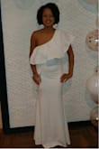 I LOVE this dress. I received so many compliments. I felt beautiful. The material fits nicely and hugs the body tight. It's nice that the dress has a liner. - Tiffany J.