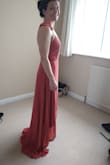 Bought for sister's wedding. Dress is lovely and the wrap feature means it can be cinched where needed. Long train if you're not super tall (I'm 5'6" and had 3" heels on and it still dragged a good few inches behind me). Fabric is polyester so bit of a shame, especially for the price! Also horrible frill things on shoulders are a nightmare if you have anything other than slight/narrow shoulders and I've had to take it to the seamstress to get them altered. Shame they send it parcelforce rather than royal mail as it got stuck in customs and I had to pay an additional £41 worth of fees. Due to this, coupled with the price in regards to a mainly polyester dress, I wouldn't purchase anything from here again. - Caroline S.