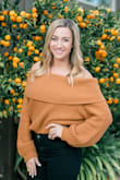 I have gotten at least a million compliments on this sweater! It's a little loose, but still fits really well! The color is perfect and it's super cozy. - Elyse R.
