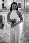 Decided to wear jumpsuit instead of conventional dress for our civil ceremony. I actually ordered XS and the jumpsuit fits perfectly! Had to bring it for alteration only because it was long for my height. I had my doubts  if the side would hold because the style was halter and amazingly it did! The fabric is a little see through as you can see on the picture. Over all I love it and I'm happy I wore it for my wedding! - Janet P.