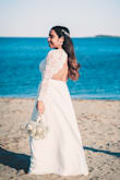 I wore this dress for my tiny wedding day, it was pretty long and I had to hemmed it, but the dress is very good quality, totally loved it and worth it and the pictures came out amazing. I am super happy with my purchase. - Melda B.